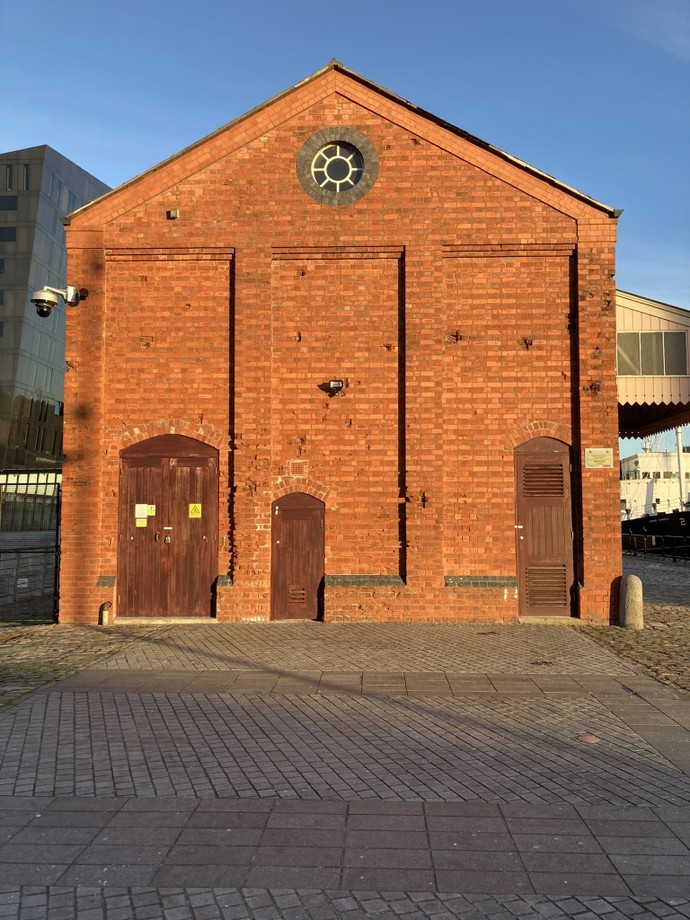 The western face of the GWR building pock marked with bomb splinter damage
